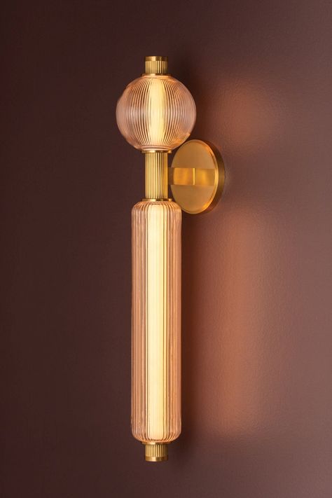 A nature-inspired spin on an iconic mid-century sputnik design, Atom brings a burst of illumination to modern interiors. This dynamic composition features glass spheres and cylinders that are brilliantly lit by energy-efficient LEDs. The reeded detailing of the arms is accented by smooth metalwork in a Vintage Brass finish. Atom is available as a 2-light wall sconce and 10 or 13-light chandeliers. *When applicable, we may remove wiring from images. *Please note, our fixtures do not come with bulbs, you may add the appropriate bulbs as an accessory. Reeded Glass Chandelier, Mid Century Wall Light, Chelsom Lighting, 70s Chandelier, Mid Century Sconces, Interior Lighting Ideas, Mid Century Modern Wall Lamp, Mid Century Modern Sconces, Atomic Decor