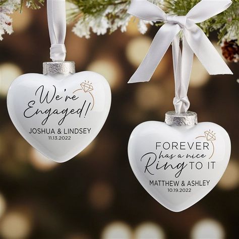 Personalize with any date and namesChoose from multiple phrases  Beautifully crafted of a glistening, ultra-polished porcelainMeasures 3"W x 3"H x 1 1/4"D, unique 3D heart shapes makes for a great addition to any treeIncludes a satin, grey hanger with bow and features an antique, matte silver cap for an elegant finishing touchReverse side of ornament is porcelain whiteImported Soon after their engagement present them with our We're Engaged Personalized Deluxe Heart Ornament; creating a perfect k We're Engaged, Engagement Present, Engagement Ornament, Personalization Mall, Barbie Gifts, Engagement Presents, Country Engagement, Engagement Ornaments, 3d Heart