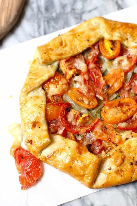 My Savory Italian Galette uses a store-bought pie crust, pesto sauce, sautéed onions, fresh tomatoes, and shaved parmesan cheese to create an amazing dish! Store Bought Pie Crust Recipes, Tomatoes And Goat Cheese, Tomato Galette, Dinner Pies, Sautéed Onions, Shaved Parmesan, Store Bought Pie Crust, Galette Recipe, Tomato Tart