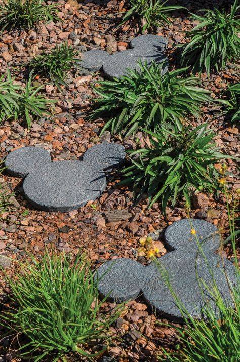 Mickey Mouse stepping stone path through landscaping. #disney #mickeymouse #landscaping #housetrends Cozinha Do Mickey Mouse, Casa Disney, Deco Disney, Disney Garden, Landscape Stone, Disney Rooms, Garden Stepping Stones, Disney Home Decor, Disney Decor