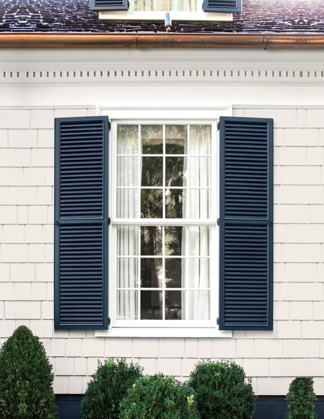 White House Dark Blue Shutters, White House Dark Gray Shutters, White Colonial Blue Shutters, How To Add Shutters To Your House, Grey House Shutters, Light Grey Siding House With Shutters, Tan House With Blue Shutters, How To Paint Shutters, Popular Shutter Colors