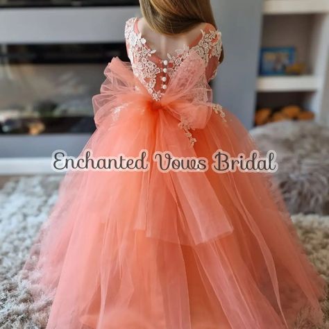 Coral Flower Girl Dress, Princess Dress -Link in bio. Flower Girl Dress in Coral, Ivory, Champagne or any colour you choose. Please message me. 🌹 A beautiful floor length tulle flower girl dress with a full tulle skirt to make your little girl feel like a true princess. This dress is made from the finest materials with exquisite embroidery and lace applique on the sleeves and front of the dress Finished with a large fluffy tulle bow, with a zip and buttons up the back. Available in Coral... Coral Flower Girl Dresses, Tulle Flower Girl Dress, Tulle Bow, Full Tulle Skirt, Coral Flower, Tulle Flower Girl, Tulle Bows, Flower Girl Dresses Tulle, Dress Princess