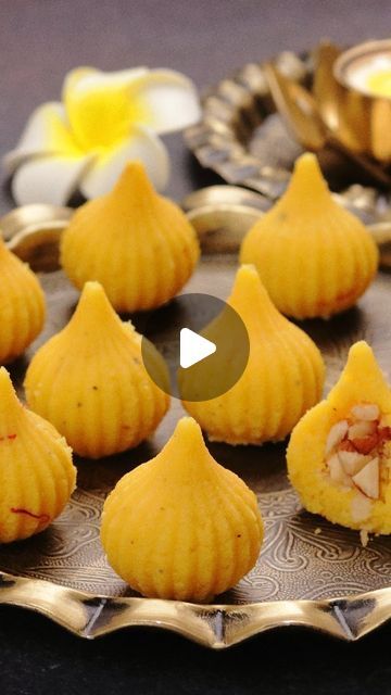 Aarti Madan on Instagram: "10 Mins quick and easy to make stuffed modak that you will love. #AartiMadan  Ingredients For Modak 3 tablespoons ghee/clarified butter 1 cup (250ml) milk 1½ cups (200g) milk powder 3 tablespoons desiccated coconut (optional) 20-22 saffron strands soaked in 4 tablespoons milk 3 tablespoons sweetened condensed milk ¼ teaspoon cardamom/elachai powder For Modak Filling 3 tablespoons cashews 3 tablespoons raisins 3 tablespoons almonds 2 tablespoons mawa modak mixture  Steps In Making  1)In a non stick or a heavy bottom pan add ghee and milk  2)Now heat the milk. Once done add milk powder in two batches and keep stirring it continuously to avoid any lumps. Cook for 2 minutes till the mixture becomes slightly thick and creamy  3)Add desiccated coconut and cook for anot Modak Recipe, Sweets Photo, Desiccated Coconut, Mumbai Food, Types Of Desserts, Indian Dessert Recipes, Indian Desserts, Indian Sweets, Indian Snacks