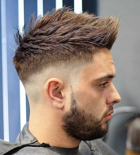 Skin sharp fade faux hawk - The high fade in this style works together with the crisp, pointy faux hawk for an outgoing masculine appearance. Fohawk Haircut, Faded Beard Styles, Trendy We Fryzurach, Faux Hawk Hairstyles, Popular Mens Hairstyles, Spiky Hair, Spiked Hair, Mohawk Hairstyles, Men Haircut Styles