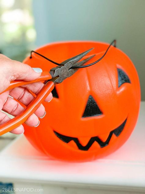 Painted Plastic Jack-O-Lantern Makeover - 2 Bees in a Pod Solar Light Jack O Lantern, Jack O Lantern Bucket Crafts, Plastic Jack O Lantern Decorations, Diy Plastic Pumpkin Makeover, Painting Plastic Pumpkins Ideas, Plastic Jack O Lantern Makeover, Plastic Jack O Lantern Ideas, How To Paint Plastic Pumpkins, Pumpkin Lanterns Diy