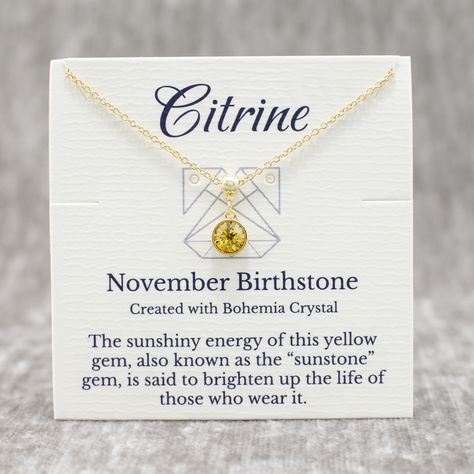 Celebrate a November birthday in style with this exquisite 14K gold plated birthstone necklace. This minimalist and dainty piece, adorned with a radiant Bohemian yellow Citrine crystal, is the perfect embodiment of elegance and sophistication. Its unique adjustable sliding lobster clasp makes it an ideal fit for everyone, from little girls and teens with smaller necks to adults. Here are some details you might appreciate: MATERIAL & COLOR: The pendant is crafted from high quality 14k gold plated metal, giving it a rich and lustrous appearance.  CHARM DESIGN: The Bohemian crystal is housed in solid bezel setting with an enclosed back to enhance the crystal’s high reflection and shield it from dirt. Your charm also features our special ball connector with silicone insert which allows you to Bohemia Crystal, Yellow Gems, November Birthday, Bohemian Crystal, Citrine Necklace, Yellow Citrine, Citrine Crystal, The Bohemian, November Birthstone