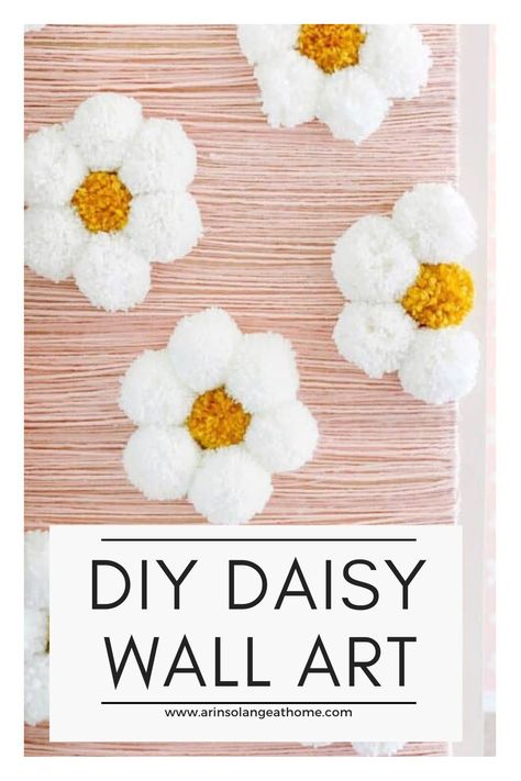 Here is a DIY step by step tutorial to making wall art out of yarn! Make beautiful daisy flowers out of yarn pom poms. This is a simple project to have a piece of statement art on a budget. Perfect for a nursery or little girls room. Floral Pom Poms, Diy Flower Pom Pom, How To Make Pom Pom Daisy, Pom Pom Daisies, Yarn Daisy Diy, Pom Pom Daisy Wall Decor, Pompom Daisy Diy, Diy Daisy Pom Pom, Flower Pom Poms Diy