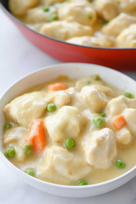 Indulge in a comforting bowl of creamy chicken soup with fluffy dumplings, perfect for cozy nights in or family gatherings. This classic recipe is easy to make and full of delicious flavors that will warm you from the inside out. Treat yourself to a taste of nostalgia with this hearty dish that brings everyone together around the table. Whether you're looking for a satisfying meal or simply craving some homemade goodness, cream of chicken soup with dumplings is sure to hit the spot every time. Chicken And Dumplings With Cream Of Chicken Soup, Creamy Chicken Dumpling Soup, Easy Chicken And Dumpling Soup, Cream Of Chicken Soup Recipes, Chicken Soup With Dumplings, Chicken And Dumpling Soup, Soup With Dumplings, Turkey And Dumplings, Creamy Chicken And Dumplings