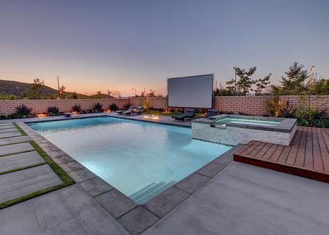 Lovely, relaxing pool area with giant screen for an outdoor movie night Pool Movie, Backyard Movie Theaters, Outdoor Movie Night, Outdoor Movie Theater, Relaxing Pool, Pool Design Ideas, Beach Entry Pool, Outdoor Movie Screen, Mansion Exterior