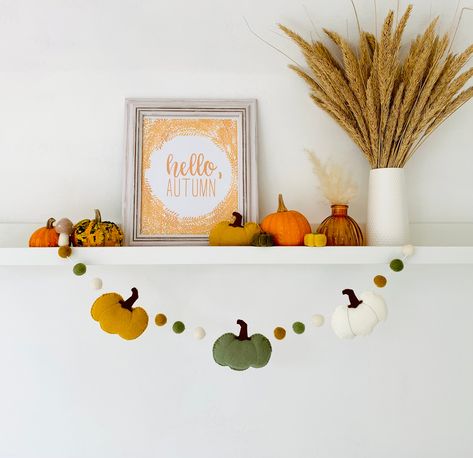 Handmade Autumn Pumpkin Felt Garland Beautiful handmade felt garland with a combination of pumpkins in mustard, sage green and natural white with matching handmade felt balls. Each pumpkin measures 9cm in height. Felt balls measure approx 2cm. The 50cm garland consists of 2 pumpkins and 9 felt balls. The 75cm garland consists of 3 pumpkins and 12 felt balls. The 100cm garland consists of 4 pumpkins and 15 felt balls. The 125cm garland consists of 5 pumpkins and 18 felt balls. The 150cm garland c Autumn Felt Garland Diy, Mustard Fall Decor, Autumn Felt Garland, Autumn Bunting, Pumpkin Bunting, Pumpkin Felt, Autumn Garland, 3 Pumpkins, Fall Garland