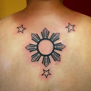 This geometric three-stars-and-a-sun backpiece. | 21 Stunningly Intricate Tattoos That Are Worth The Pain 3 Stars And A Sun, A Sun Tattoo, Philippines Tattoo, Monarch Tattoo, Sun Tattoo Designs, Filipino Tattoos, Mens Shoulder Tattoo, Hawaiian Tattoo, Intricate Tattoo