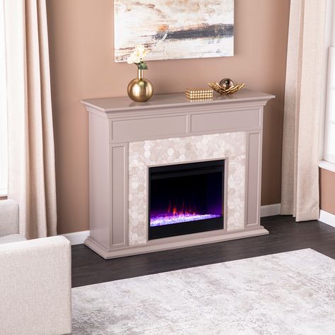 Modernize your media room with this gray and white marble fireplace. Hexagon shaped tile and authentic marble join together to craft a look that's both homey and elegant. Painting Electric Fireplace Tile, Tiled Electric Fireplace, Faux Stone Electric Fireplace, Painted Fireplace Mantels, Stone Electric Fireplace, White Marble Fireplace, Indoor Electric Fireplace, Paint Fireplace, Marble Fireplace