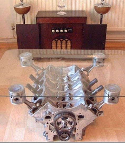 Man Cave Coffee Table. Would your hubby go crazy for this table? Call the design/build team of MM Property Management and Remodeling to transform your basement into a man cave. Serving Kansas City, MO and KS. 913-871-6867 Man Cave Coffee Table, Engine Coffee Table, Engine Table, Old Car Parts, Koti Diy, Car Part Furniture, Ikea Catalog, Automotive Furniture, Car Furniture