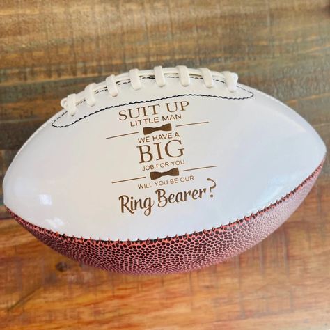 "FOR UNITED STATES FREE SHIPPING ORDERS OVER $35 AND 25% OFF STORE WIDE YEAR END SALE These Ring Bearer, Jr. Groomsman proposal footballs are a great way to ask the little guys to be on your team for that special day! The engraving comes out to a warm brown color with easy to read contrast. This is an \"engraved\" football and when engraved into the leather it is permanent and reveals the natural brown color. There is NO other color option available. The engraving will last forever and will not Ring Bearer Proposal, Ring Bearer Gift, Year End Sale, Junior Groomsmen, Groomsman Proposal, Ring Bearer Flower Girl, Ring Bear, Ring Bearer Gifts, Something Old Something New