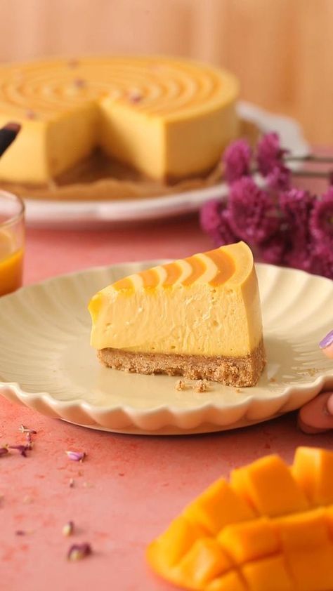 This tasty baked mango cheesecake combines the decadent creaminess of a classic cheesecake with the tropical flavor of mango. It is basically summer in a cake slice form! The velvety smooth cheesecake recipe is made with mango puree (mango pulp), eggs, cream cheese and a touch of sour cream (we need that tang!). Make it for summer bbqs, birthdays, baby showers or just about any occasion! Baked Mango, Eggs Cream Cheese, Slice Form, Fun Cheesecake Recipes, Mango Dessert Recipes, Mango Pulp, Cheesecake Toppings, Cream Cheese Desserts, Mango Dessert