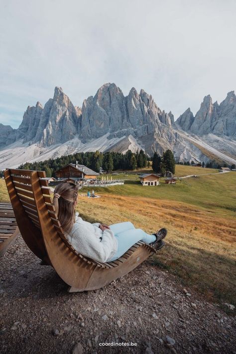 Sarah sitting on a wooden lounger watching over a alpine meadow with a mountain hut and trees, with dramatic mountain peaks in the background. Hiking Dolomites Italy, Dolomites Photography, Venice In Winter, Switzerland Trip, Hiking Adventures, Travel Switzerland, North Of Italy, Travel Preparation, Hiking Fits