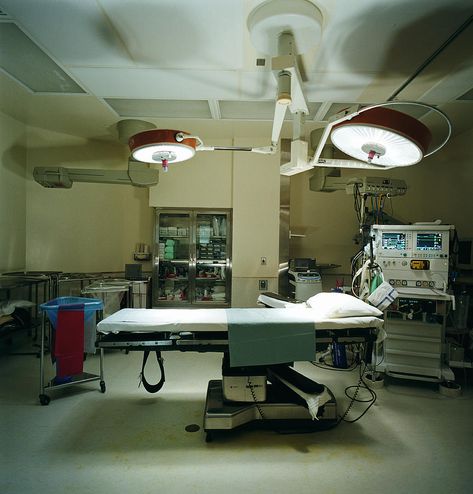 Operating room, lights shining on operating table Photograph by Richard Ross Operating Table, Book Presentation, Hospital Interior, Hospital Room, Operating Room, Doctor Office, Extra Rooms, Room Doors, Abandoned Houses