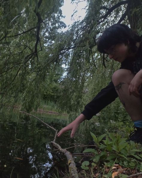 Alternative boy sitting next to a pond, almost touching the water. There are willows around him. Toni + Core + Aesthetic, Ren Core Aesthetic, Morvarid Core, Kae Core Aesthetic, Tommy Core Aesthetic, Sinead Core, Alexa Core Aesthetic, Lee Core Aesthetic, Darya Core