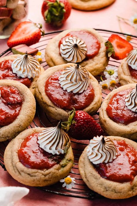 Strawberry Rhubarb Cookies are summer's favorite pie in cookie form! Thick & chewy sugar cookies are filled with a quick stovetop strawberry rhubarb filling and topped with swirls of toasted swiss meringue. They're also delicious topped with whipped cream! It's all the flavor of a strawberry rhubarb pie without the fuss. Strawberry Rhubarb Cookies, Rubarb Pie, Rhubarb Filling, Rhubarb Cookies, Strawberry Rhubarb Jam, Strawberry Rhubarb Pie, Pie Cookies, Rhubarb Pie, Chewy Sugar Cookies