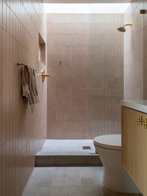 The white zellige tile across one bathroom’s wall matches the material of those used by the pool, but the ochre-hued squares lining the floor riff on their shape. Meanwhile, the primary suite’s shower is outfitted in rectangular tile, and the ones in the ADU office’s pink bathroom have the same look. Zia Tile Bathroom, Wood Walkway, Zia Tile, Living Room And Kitchen Design, Organized Lifestyle, Glazed Brick, Primrose Hill, Shower Floor Tile, Living Room Design Inspiration