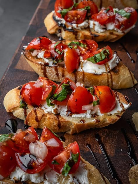 Toasted baguette with goat cheese, cherry tomatoes, basil and balsamic glaze. Tomato Basil Bruschetta Recipe, Burrata Bruschetta Recipe, Bruschetta With Goat Cheese, Bruchetta Appetizers, Goat Cheese Bruschetta, Italian Starters, Recipe With Tomatoes, Cheese Bruschetta, Tomato Bruschetta Recipe