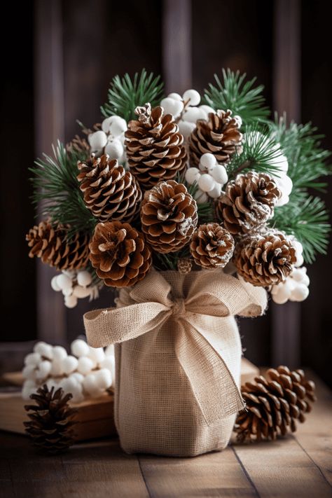 These rustic bunches look stellar with simple ceramic dishes; imagine a canvas of white, where your centerpiece paints the color. #Christmas #Holidays #HomeDecor Christmas Pine Cone Decorations, Simple Rustic Christmas Decor, Burlap Ornaments, Diy Natal, Elf Decorations, Christmas Pine Cones, Christmas Craft Ideas, Natural Christmas Decor, Burlap Decor