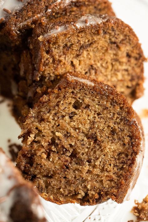 Tender and flavorful banana bread bundt cake made with overripe bananas, chocolate chips, or chocolate streusel and covered with a simple powdered sugar glaze. #whereismyspoon #bananabundtcake #bananabreadbundtcake #bananabreadrecipes #bananacake #bananarecipes #bakingcake #easybakes Banana Cake Bundt, Banana Bread In Bundt Pan, Bundt Pan Banana Bread, Banana Bread Bundt, Banana Bread Bundt Cake Easy Recipes, Banana Bread Bundt Pan, Bundt Banana Bread Recipe, Banana Bundt Bread, Bundt Cake Banana Bread