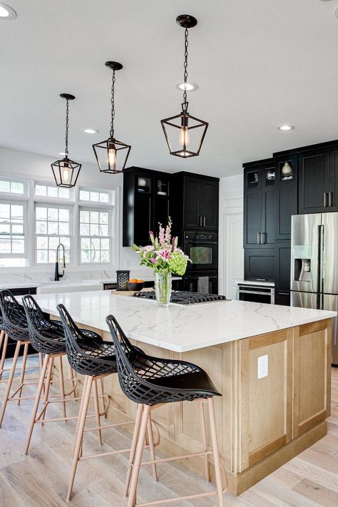 This transitional style kitchen design features cabinets in two brands and finishes. The perimeter cabinets are Greenfield Cabinetry in the Jackson A door style with a Painted Black finish. The kitchen island cabinets are Merillat Classic in the door style Glenrock in Maple with the finish Boardwalk. The kitchen countertops are MSI Q Calacatta Laza. - See more at: https://www.reico.com/projectgallery/472146 #transitional #twofinish #kitchenideas #remodelideas #kitchendesign Merillat Kitchen Cabinets, Merillat Cabinets, Calacatta Laza, Transitional Style Kitchen, Island Cabinets, Classic Cabinets, Kitchen Island Cabinets, Maple Kitchen Cabinets, Maple Kitchen