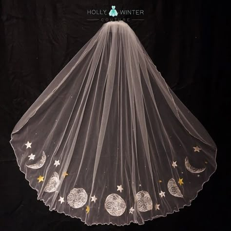 An ivory fingertip veil embroidered with phases of the moon and stars by Holly Winter Couture Moon And Stars Wedding Veil, Moon Phase Veil, Starry Wedding Veil, Moon Wedding Veil, Galaxy Wedding Veil, Celestial Wedding Veil, Unique Veil Ideas, Sun And Moon Wedding Theme, Starry Veil