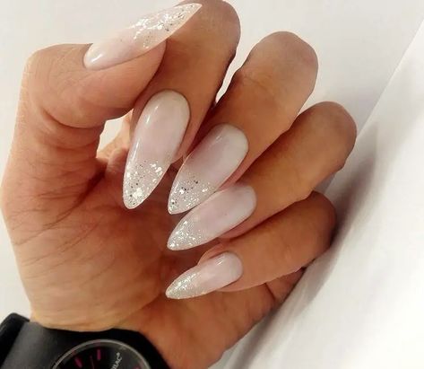 18 Elegant Milky White Almond Nails Long | Designs & Inspiration Milky White Nails With Glitter Almond, Milky White Nails With Glitter Tips, Almond Nails White Glitter, Milky White And Glitter Nails, Milky White Nails With Design Almond, White Nails With Glitter Tips, White Milky Nails Design, Almond Nails Milky White, Milky White Glitter Nails