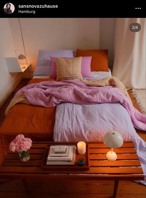 Pink And Orange Apartment Aesthetic, Orange Pink Bedding, Pink Orange Bedding, Mauve And Orange Bedroom, Mismatched Bedding Aesthetic, Muted Color Bedroom, Cozy Colourful Bedroom, Neutral Bedroom Pop Of Color, Pink And Orange Bedroom Ideas