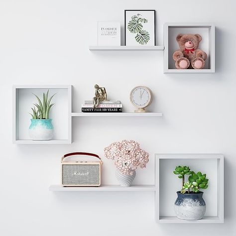 About this item 【Multifunctional Floating Cube Shelves】A set of 6 different sized shelves, including 3 square storage shelves and 3 wall mounted floating shelves, can help you create your own storage combinations for different display needs. Reduce clutter and highlight your stylish decor while keeping everything organized. You can hang them together in a collage style or use individually. 【Modern & Rustic Design】The wall box shelf features a unique cube solid structure with floating shelves to provide more storage space. The driftwood finish creates a beautiful and natural look that will add a modern ambiance to your living space. You can create an exquisite design collage wall with your favorite photos, plants, collectibles, etc. 【Perfect for Display】Let your creative side rub off with d Floating Square Shelves, Square Shelves On Wall, Square Shelves Decor Cubes, Square Shelf Decor, Shelves Above Desk, Wood Honeycomb, Floating Cube Shelves, Square Shelves, Square Floating Shelves