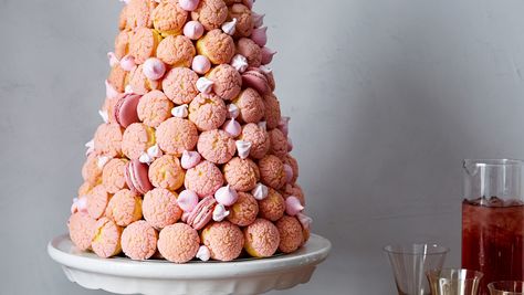 French for "crunch in the mouth," croquembouche is a tower of cream puffs held together by hot caramel. Martha makes the dessert even more showstopping by turning the pastries pink and filling them with strawberry buttercream. Croquembouche Recipe, Best Christmas Crackers, Cream Puff Filling, Christmas Cracker, Strawberry Buttercream, Pink Food Coloring, Birthday Desserts, Pink Foods, Christmas Crackers