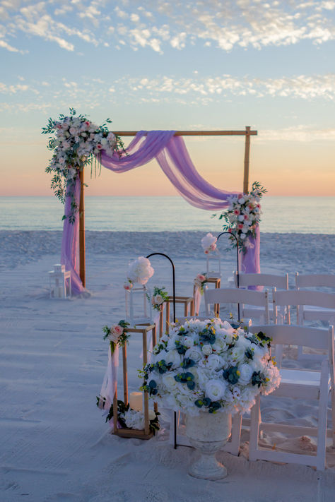 Pink sunset beach wedding in Florida Tangled Beach Wedding, Beach Wedding Lilac, Lavendar Wedding Beach, Beach Wedding Purple Theme, Beach Wedding Lavender, Pink And Blue Beach Wedding, Colourful Beach Wedding, Purple Beach Wedding Ideas, Pink Coastal Wedding