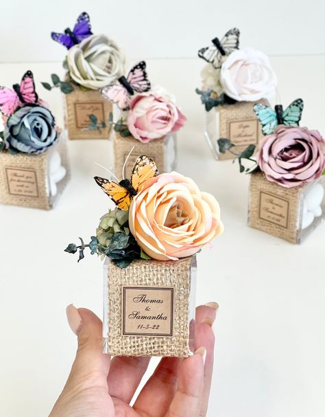 "6 pcs Butterfly Favors Boxes for Guests, Butterfly Party Favors, Birthday Favors, Custom Favors, Quinceanera Favors, Favors Gifts, Favors  DETAILS: - Quantity: 6 favors per pkg. - Materials:Plastic box,fake flower,paper tag, ribbon, candy - Favors are wrapped and packaged securely and safely for shipping. SIEZ: -1 3/4\"x1 3/4\"x1 3/4\" -4.5cm x 4.5cm x4.5cm  NOTE: For order corsage and boutonniere https://www.etsy.com/shop/WhiteRoomAccessories   TO ORDER - 2 NAMES - DATE of wedding - all of the Butterfly Quinceanera Theme, Butterfly Baby Shower Favors, Favors Quinceanera, Butterfly Party Favors, Butterfly Favors, Quinceanera Favors, Handmade Favors, Party Favors Birthday, Table Favors