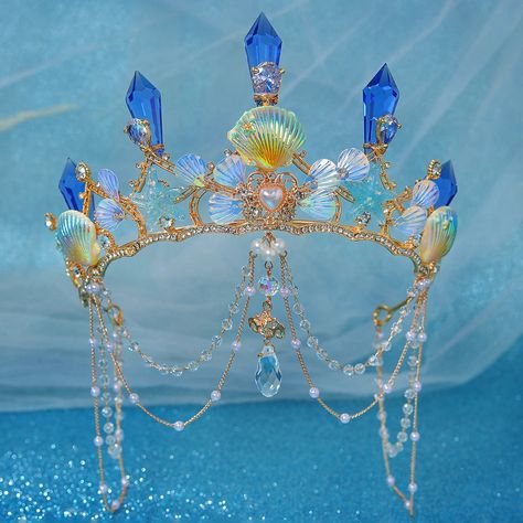 Transform into a mermaid princess with our Crystal Rhinestone Sea Shell Tiara Crown! Handmade with a sturdy metal base and oversized crystal spikes, this tiara comes in multiple variations to suit your mermaid party style. Shine like a star with ocean-themed accents and be the center of attention at your event! material: metal, crystal, beading color: as shown gender: women type: tiara crown Crowns References, Ocean Themed Accessories, Mermaid Visuals, Chaumet Tiara, Ocean Crown, Shell Tiara, Water Crown, Mermaid Ears, Sea Crown