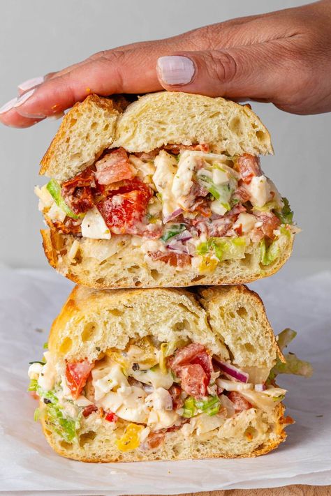 This viral Chopped Italian Sandwich is an absolute flavor bomb! It's your favorite ingredients of an Italian sub sandwich, chopped into bite sized pieces so you get a little taste of everything in every bite Italian Ciabatta Sandwich, Ciabatta Bread Sandwich Ideas, What To Do With Ciabatta Bread, Benedictine Sandwich, Italian Hoagie Sandwiches, Sub Sandwich Ideas, Famous Sandwiches, Chopped Italian Sandwich, Chopped Sandwich