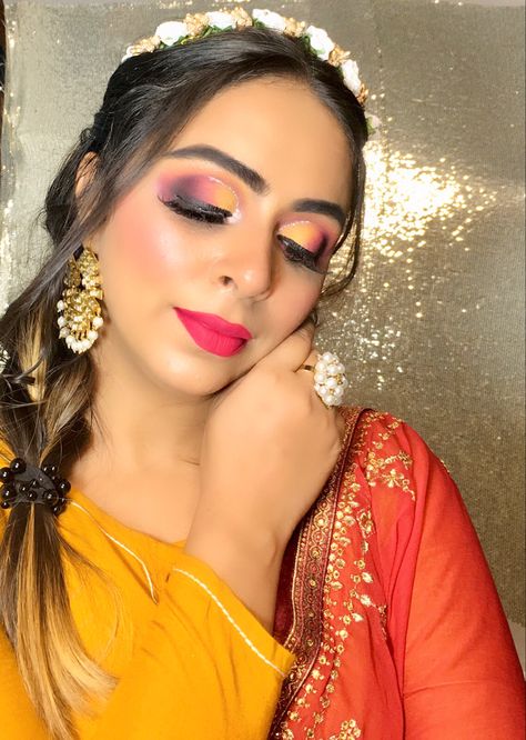 Yellow & pink smokey eye makeup Eye Makeup For Yellow Saree, Pink Yellow Eye Makeup, Makeup On Yellow Lehenga, Haldi Makeup Look, Yellow Lehenga Makeup Look, Pink Smokey Eye Makeup, Pink Yellow Eyeshadow, Pink Orange Yellow Eye Makeup, Haldi Makeup