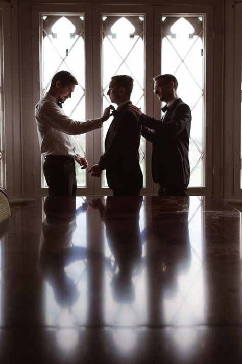 A groom prep photo with groomsmen getting ready Men’s Wedding Photos, Groom Wedding Prep Photos, Wedding Photos Groom Getting Ready, 2 Groomsmen Photos, Getting Ready Pics Wedding, Groomsmen Photoshoot Before Wedding, Groom Best Man Pictures, Groom Wedding Photos Getting Ready, 3 Groomsmen Photos