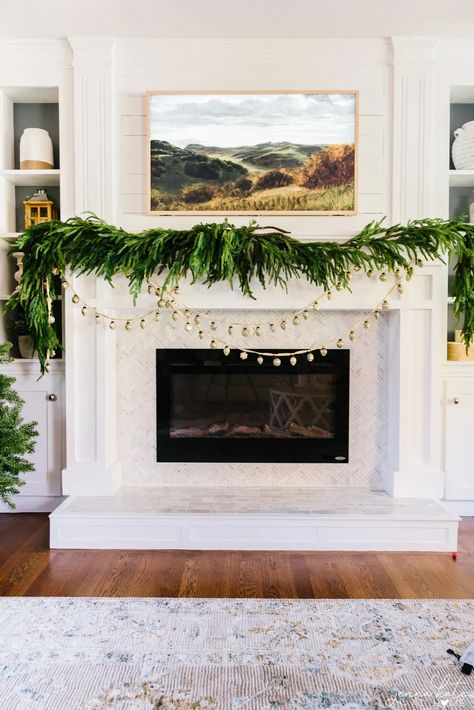 Learn the best tips and tricks for hanging garland on your mantel this Christmas. Layered Christmas Garland, Fireplace With Garland, Jenna Loves Christmas, Christmas Mantle 2023, Faux Garland Christmas, Christmas Garland On Mantle, Mantel Christmas Decorating Ideas, Garland On Mantle, Christmas Mantle Garland