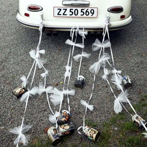 Customarily, couples will add ribbons to their wedding cars and tin cans trail behind. But this isn’t the only option. Think about getting involved with some DIY car decorations and including flowers, balloons or other signs to your car to make it even more special. Similarly, why not add photos to your tin cans and compliment your ribbons with bunting?! The DIY design world is your oyster! Cans For Wedding Car, Tin Cans Wedding Car, Just Married Cans On Car Diy, Wedding Car Cans, Wedding Cans For Car, Cans On Back Of Car Wedding, Just Married Car Cans, Just Married Car Decorations, Just Married Car