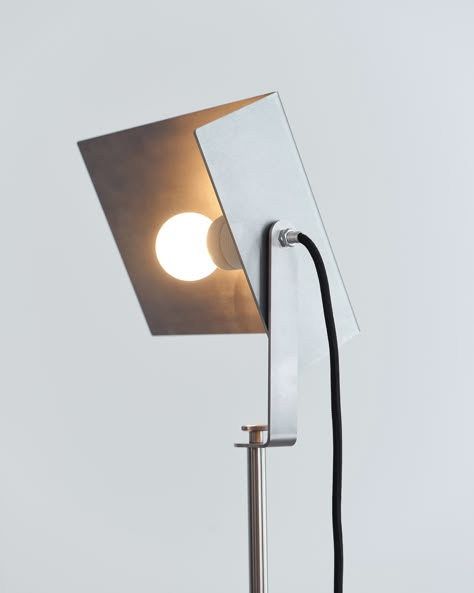 A slender stem, simple shade, and striped-down aesthetics create a minimalist industrial allure for a modern floor lamp. Crafted in stainless steel, it delivers a robust ambiance and lovely illumination, complete with a natural finish and a covered cord with a step switch for easy operation in your living room or den. Features: Offer bright, diffused illumination with a modern floor lamp Striped down style simplifies lighting design to bare necessities for a minimalist presentation Can be taken apart completely Features stainless steel construction An artistic reinterpretation of the iconic Joseph Beuys lamp from 1960. From Studio Frederik Fialin Materials: Stainless Steel, Felt, Lighting Assembly Measurements: Dimensions (cm): 35L x 42W x 178H Shipping info: Production Lead Time: 4-6 week Industrial Lamp Design, Joseph Beuys, Stainless Steel Lamps, Ceramic Furniture, Tall Lamps, Stainless Steel Lighting, Industrial Photography, Table Sofa, Industrial Lamp