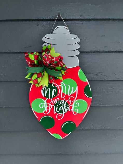 This door hanger is perfect to hang on your door all winter long. It has a cute little ribbon bow. The ribbon is high quality. It is hand painted and sealed. It is 19 inches long. It has traditional Christmas colors. It says merry and bright.  Comes in a sturdy box for storage.  Comes from a dog friendly home. Marshmallow Crafts, Diy Christmas Door, Wood Christmas Decorations, Door Hanger Christmas, Welcome Door Hanger, Decor Front Porch, Door Hangers Diy, Wooden Signs Diy, Door Signs Diy