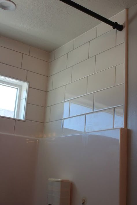 Subway tile above shower surround Makeover Kamar Mandi, Tile Tub Surround, Bathtub Surround, Modern Bathroom Remodel, Shower Inserts, Fiberglass Shower, Bathtub Remodel, Bathroom Remodel Tile, Tub Surround