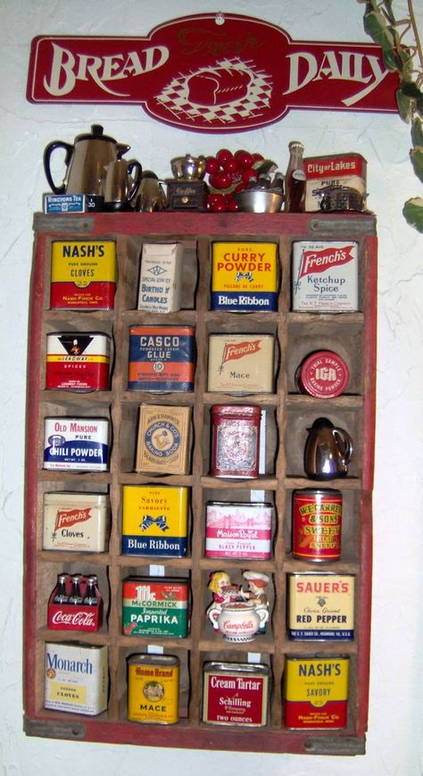 One of my vintage tin displays in my kitchen. Vintage Tin Display, Kitchen Display Wall, Vintage Spice Tins, Crate Display, Vintage Kitchen Items, Spice Collection, Antique Tins, Lata Vintage, Vintage Kitchen Utensils