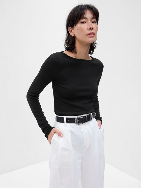 Soft knit stretch cotton and modal t-shirt.  Boatneck.  Long sleeves.  Straight silhouette with a slim fit.  Hits at the hip.  Models wearing Gap Black Boatneck Top, Fw 2024, Boat Neck Shirt, Romanticizing School, 2024 Wishlist, Wardrobe Capsule, Black Shirts Women, Shopping Clothes, Winter Vibes