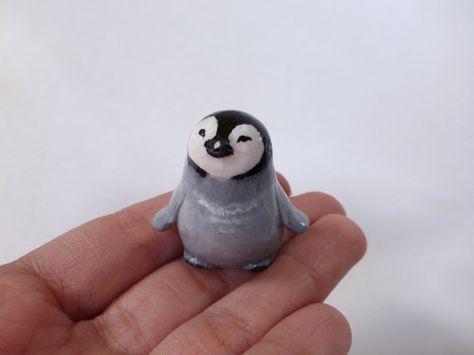 This figurine of baby penguin is completely handmade from a polymer clay. Then painted with acrylic paint and finished with glossy varnish. Size: 3,5 cm ( 1,3 inch) The figurine arrives in a gift handmade box. Please, dont use it as a toy for small children. More of unique gifts you Polymer Clay Small Figures, Clay Penguin Sculpture, Penguin Clay Art, Small Clay Animals, Tiny Clay Things, Penguin Habitat, Polymer Clay Penguin, Penguin Ceramic, Clay Penguin