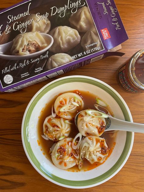 Trader Joe's soup dumplings in bowl topped with chili sauce. Trader Joe’s Potstickers, Trader Joe’s Chicken Soup Dumplings, Trader Joe’s Dumpling Soup, Trader Joe’s Dumplings, Trader Joe’s Soup Dumplings, Chinese Dumpling Soup, Trader Joes Soup, Easy Dumplings Recipe, Chicken Dumpling Soup