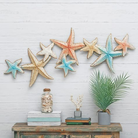 PRICES MAY VARY. 60 Day No Hassle Returns A Bella Coastal Decor Exclusive - Group of metal starfish in muted coastal colors. 46 1/2"W x 19"H. Coastal Dinnerware, Coastal Bedroom Furniture, Black Forest Decor, Hanging Furniture, Hanging Artwork, Hanging Candles, Coastal Colors, Coastal Bedroom, Hanging Wall Mirror