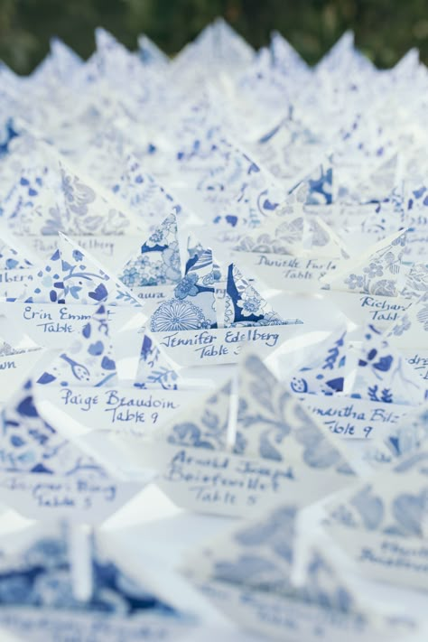 DIY origami sailboat wedding name cards in blue and white patterned paper. Coastal and beachy wedding placecards and seating chart. Coastal Place Cards, Sailboat Seating Chart, Coastal Wedding Place Cards, Wedding Place Card Ideas Seating Charts, Beachy Seating Chart Wedding, Diy Coastal Wedding Decor, Summer Coastal Wedding, Coastal Elegant Wedding, Name Places For Wedding